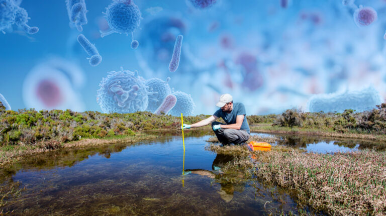 A scientist measuring environmental water quality. Credit: iStock